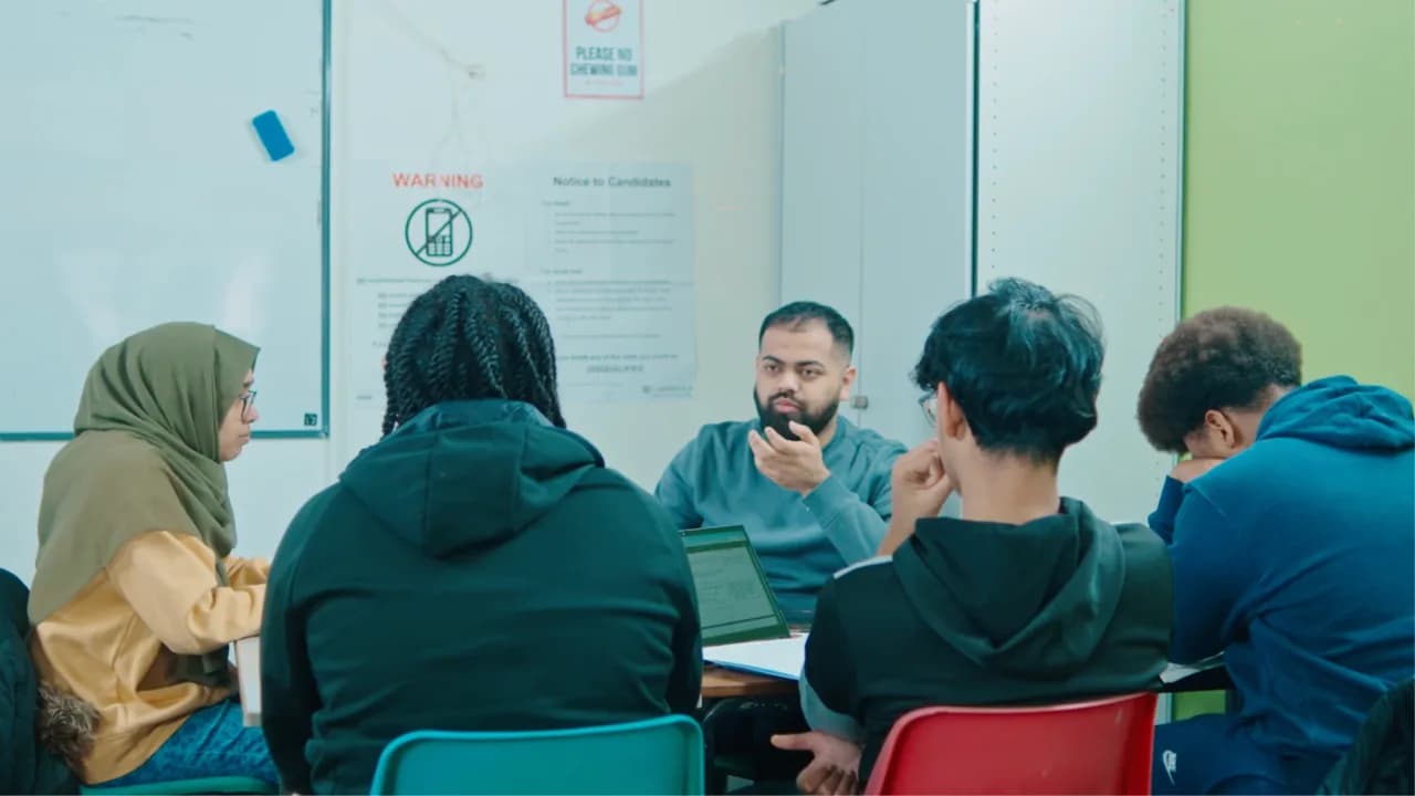 Students learning together in a small class at an Excel Tutors centre in East London